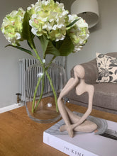 Load image into Gallery viewer, stone effect thinking figure, styled on top of a book on a coffee table
