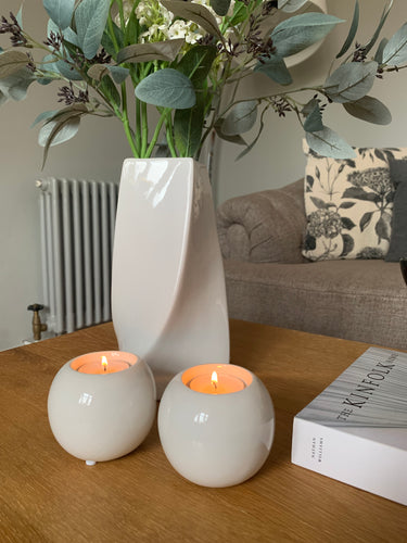 Esme is a beautiful ceramic tea light holder. In gloss white with a lovely curved shape. Ideal for a coffee table or dining table for that subtle candle light