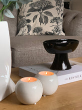 Load image into Gallery viewer, Esme is a beautiful ceramic tea light holder. In gloss white with a lovely curved shape. Ideal for a coffee table or dining table for that subtle candle light
